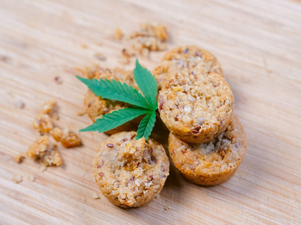 Cannabis leaf laying on top of baked goods choosing the perfect edible