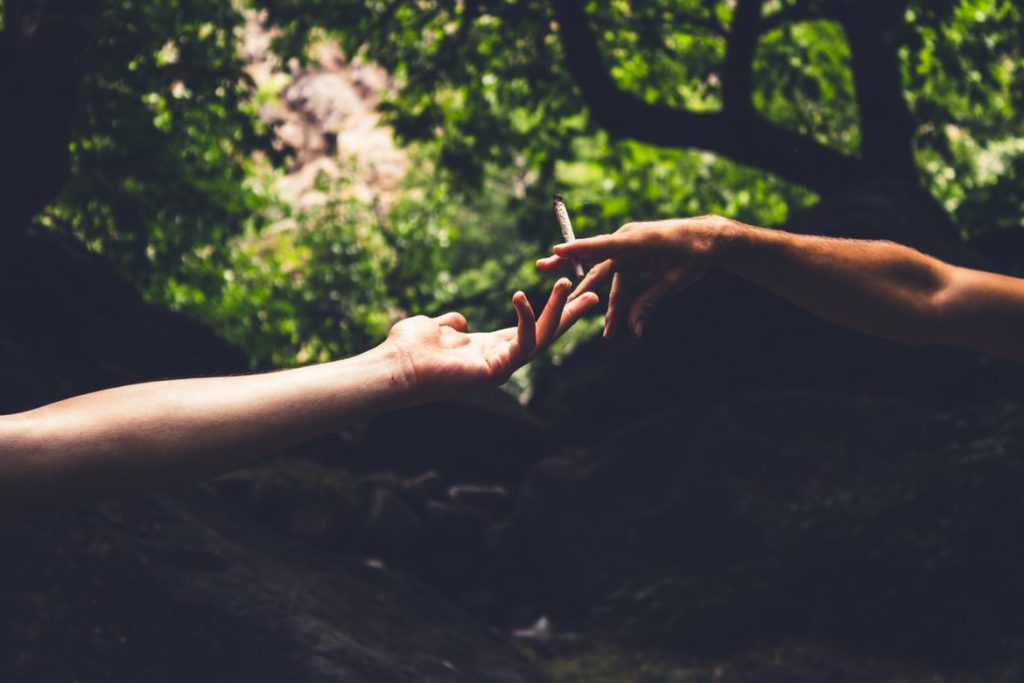 hands reaching out passing off joint