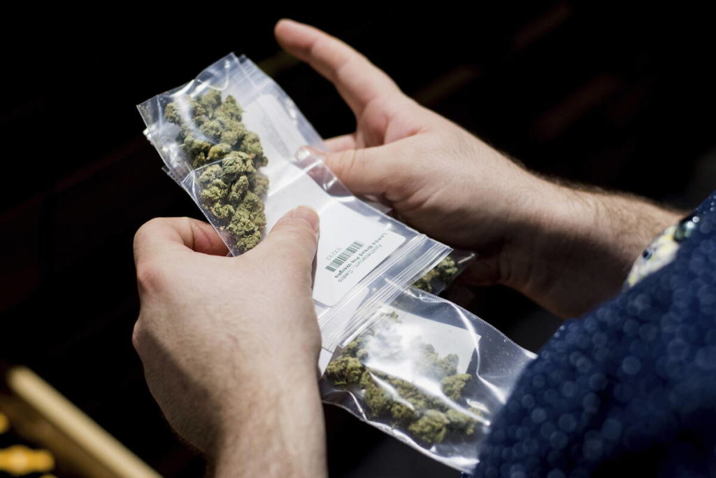 Man holding cannabis packing